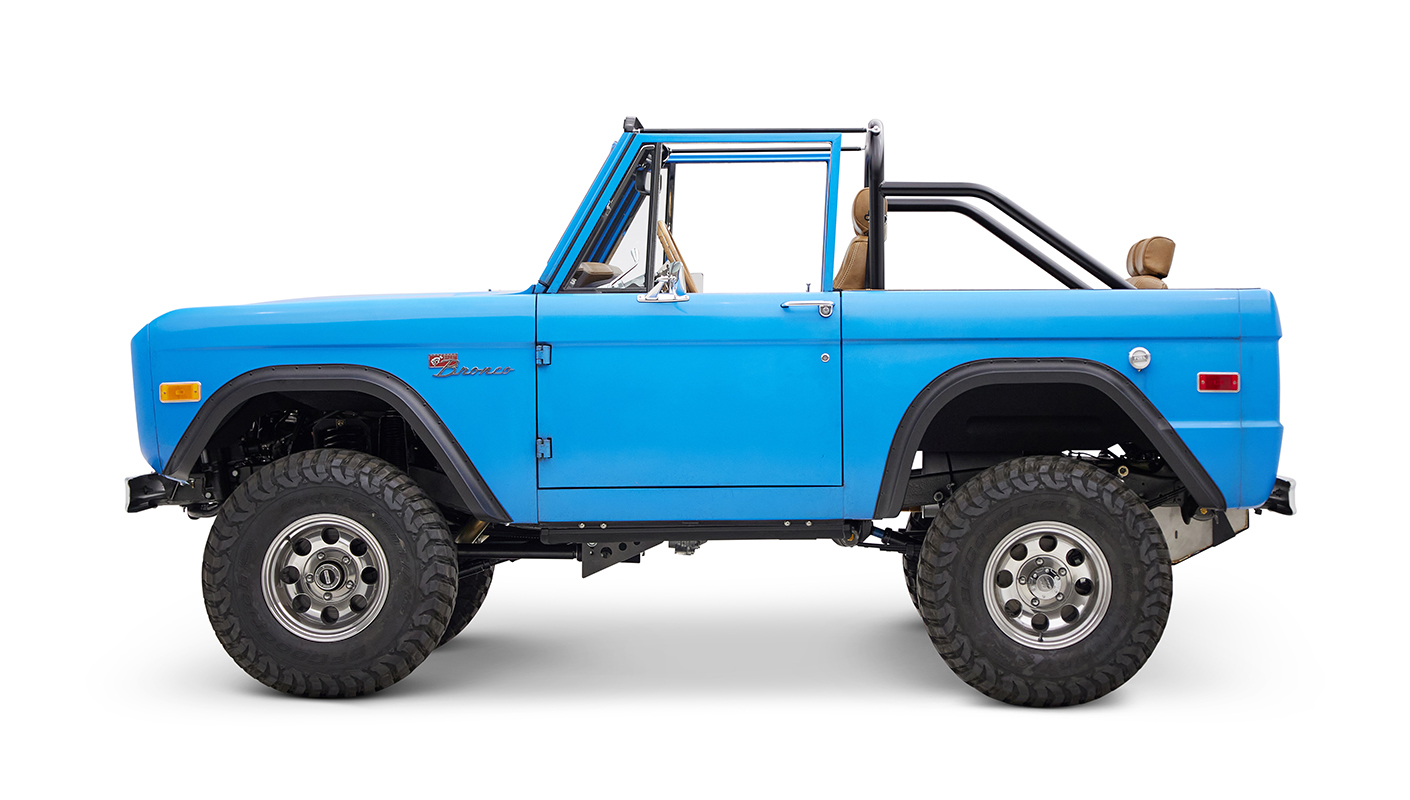 1976 classic ford bronco in blue patina paint with whiskey leather interior driver profile