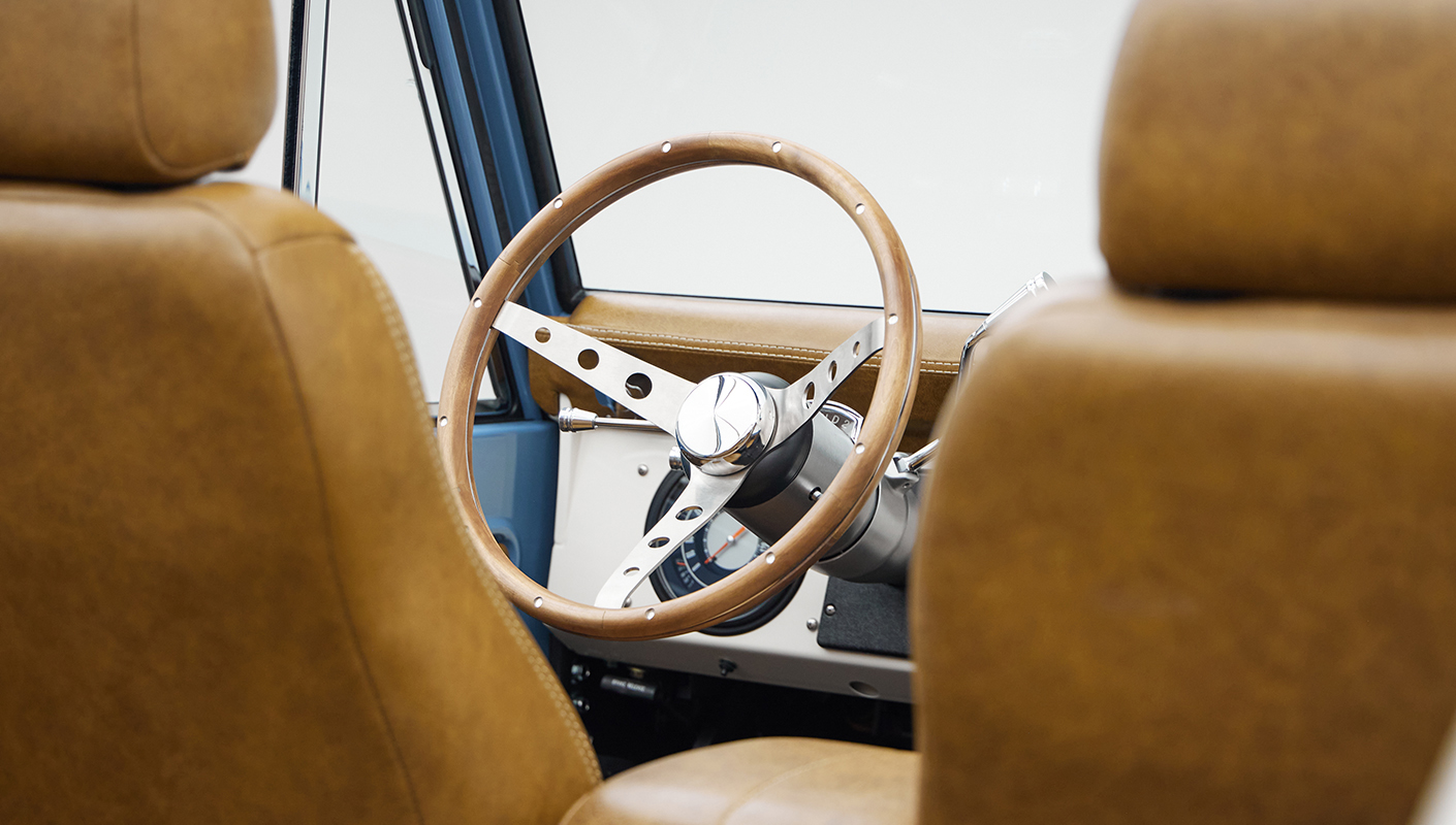 1974 classic ford bronco in stars & stripes blue with whiskey leather steering wheel